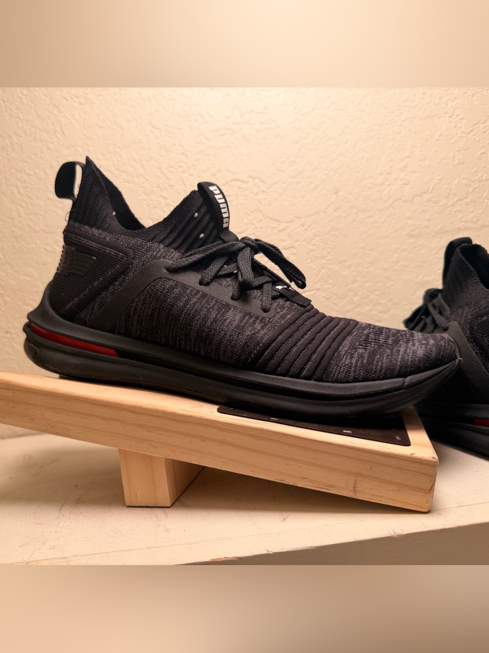 Puma Men’s Black Knit Athletic Sneaker with Red Accent